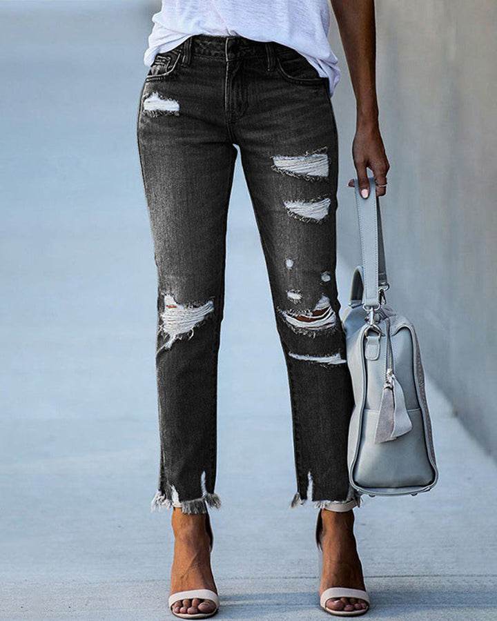 Clara | Jeans ajustats per a dones amb rips i vores desfilades