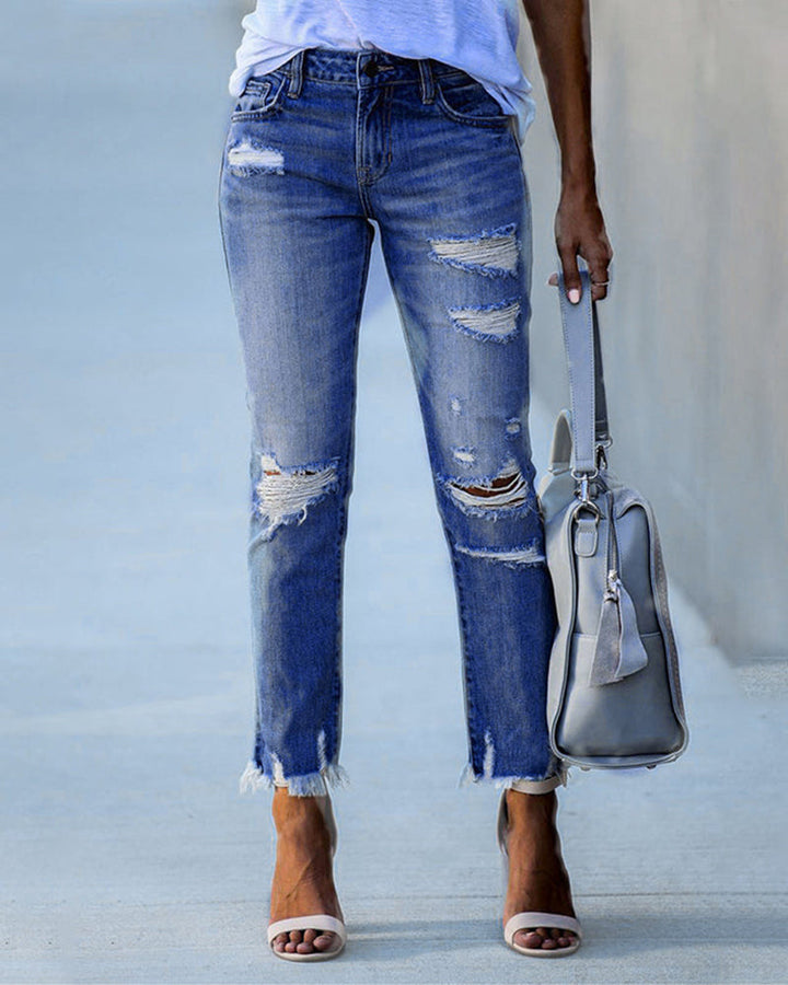 Clara | Jeans ajustats per a dones amb rips i vores desfilades