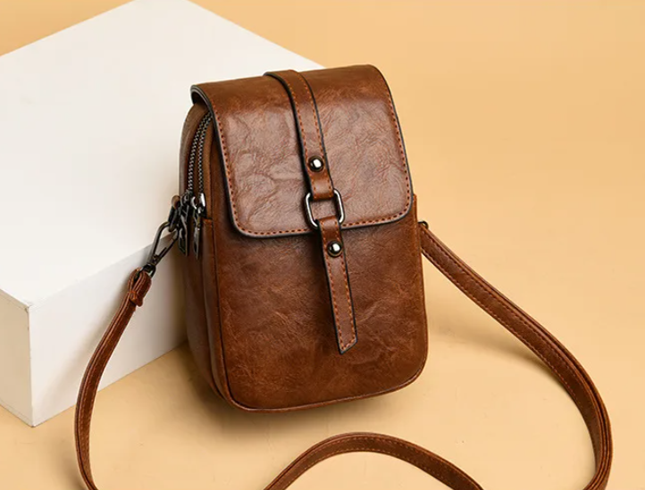 Bossa de mà vintage de cuir suau amb estil