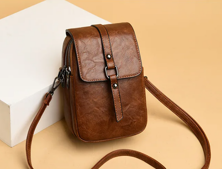 Bossa de mà vintage de cuir suau amb estil