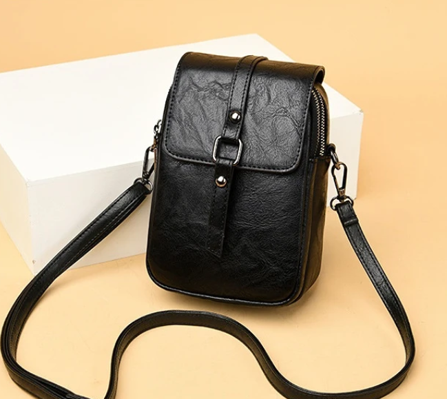 Bossa de mà vintage de cuir suau amb estil